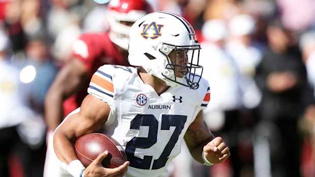 Oct 16, 2021; Fayetteville, Arkansas, USA; Auburn Tigers running back Jarquez Hunter (27) rushes during the first quarter against the Arkansas Razorbacks at Donald W. Reynolds Razorback Stadium. Mandatory Credit: Nelson Chenault-USA TODAY Sports